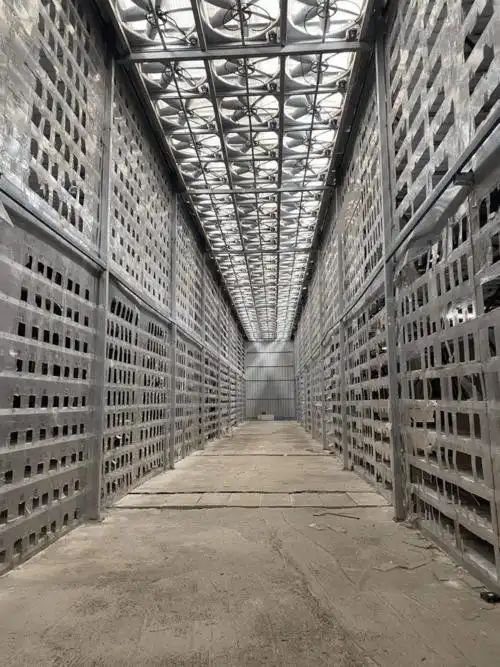 A sprawling mining farm filled with rows of mining equipment cooling in a data center